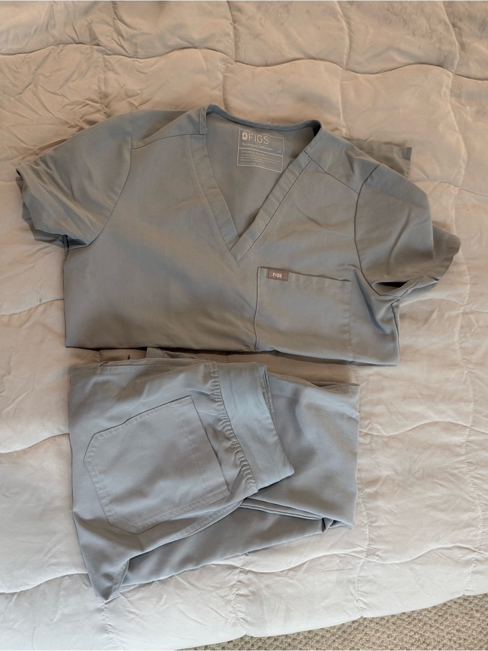 FIGS Women’s Short Sleeve Catarina Scrub Top and Pant Set in Dusty Blue